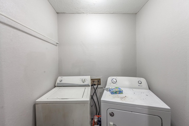 washroom with independent washer and dryer