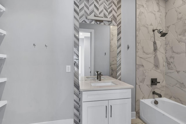 bathroom featuring vanity and tiled shower / bath