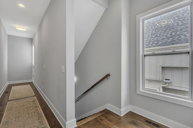 stairs featuring wood-type flooring