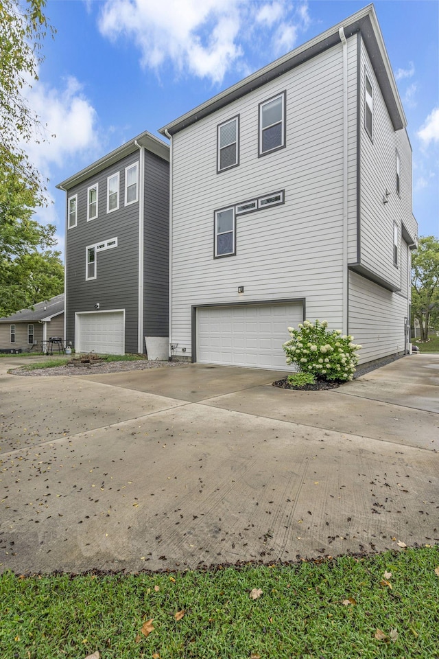 rear view of house with a garage