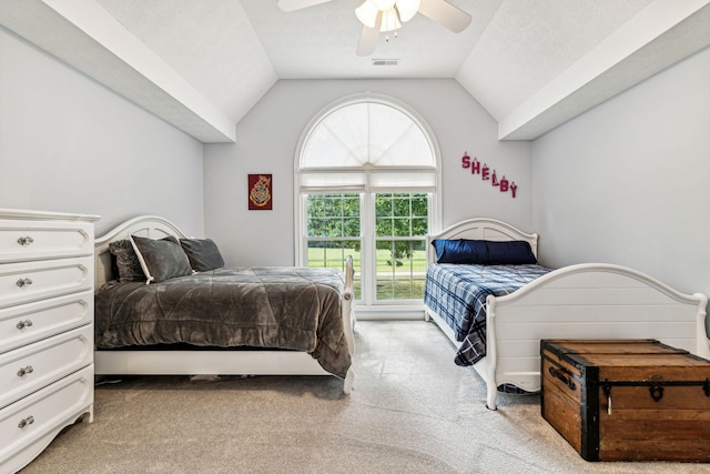 carpeted bedroom with lofted ceiling and ceiling fan