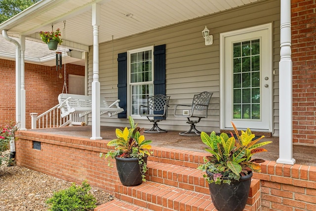 doorway to property featuring covered porch