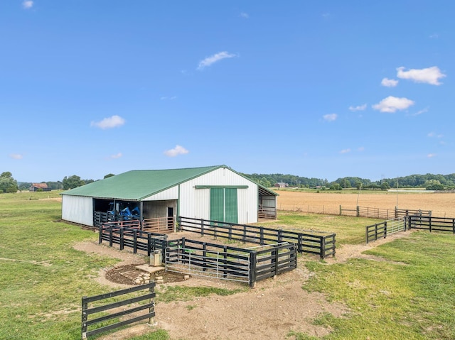 view of horse barn featuring a rural view