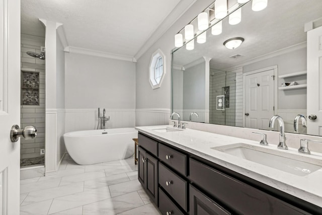 bathroom with vanity, crown molding, and independent shower and bath