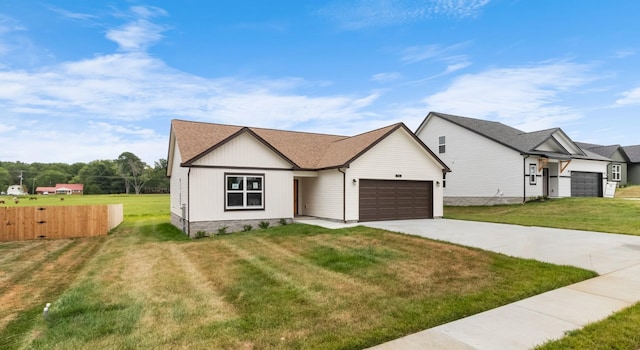 view of front of house with a garage and a front yard