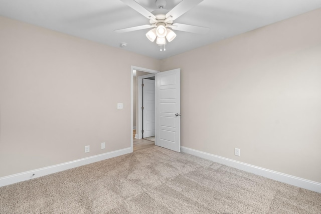 carpeted empty room with ceiling fan