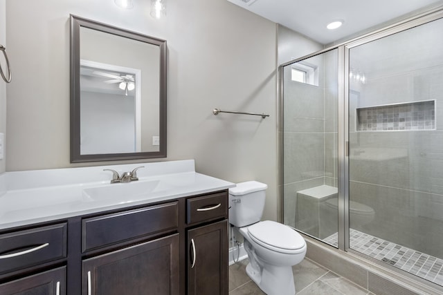 bathroom featuring vanity, toilet, and walk in shower