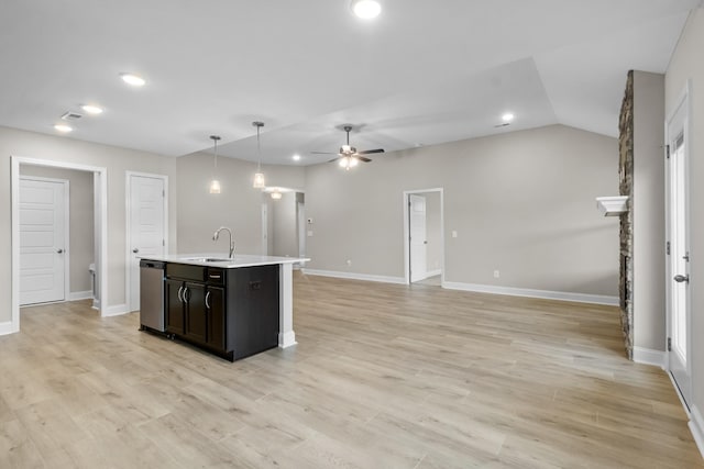 kitchen with an island with sink, sink, ceiling fan, dishwasher, and pendant lighting