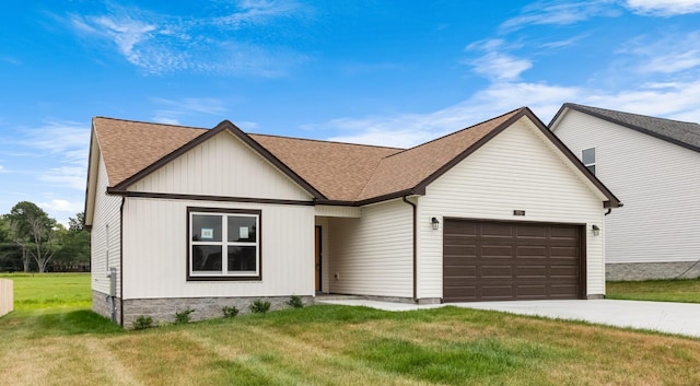 view of front of home with a garage and a front yard