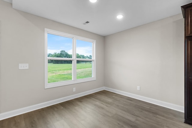 spare room with hardwood / wood-style flooring