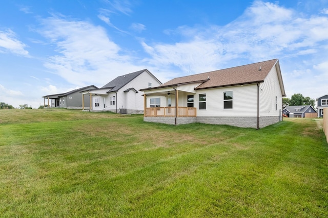 back of house featuring a yard and a porch