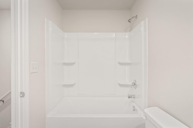 bathroom with shower / tub combination and toilet