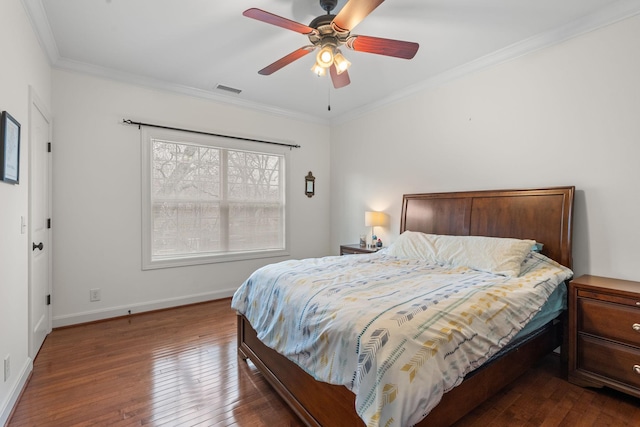 bedroom with crown molding, dark hardwood / wood-style flooring, and ceiling fan