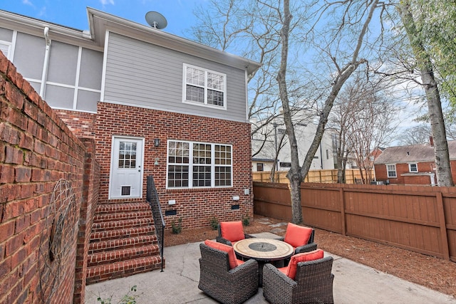 rear view of property featuring a patio area