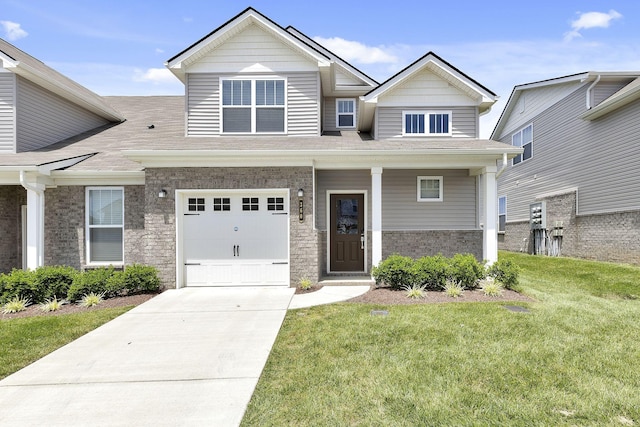 view of front facade with a garage and a front yard