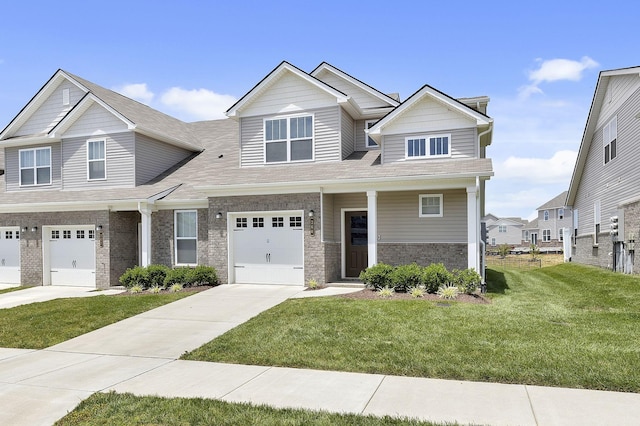 view of front facade featuring a front yard and a garage