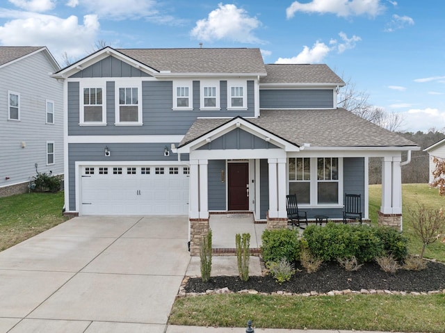 view of front facade featuring covered porch and a garage