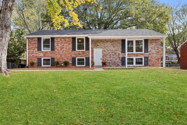 raised ranch with a front lawn