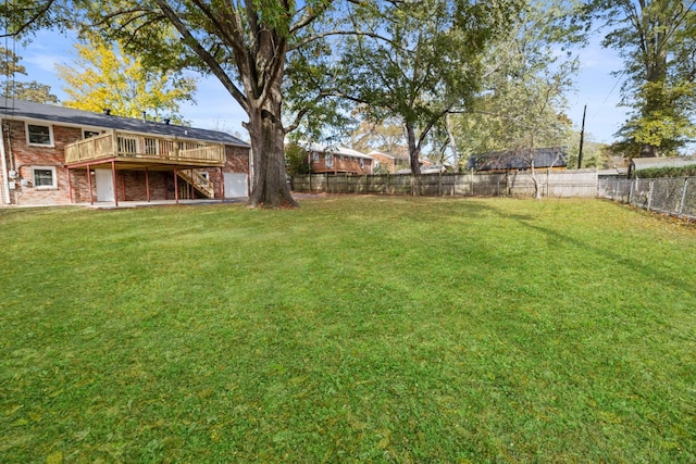 view of yard featuring a wooden deck