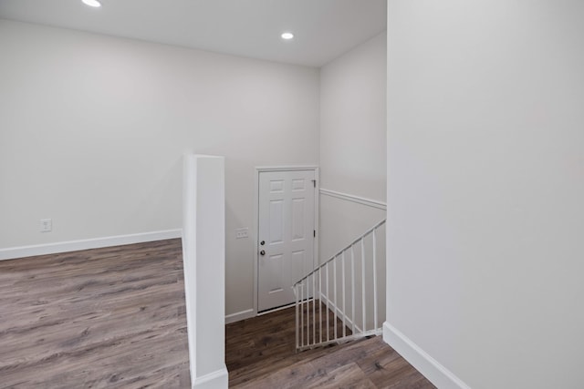 stairway featuring hardwood / wood-style floors