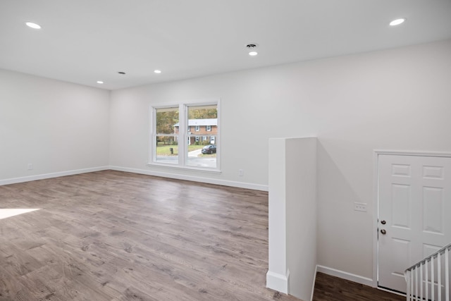 spare room with hardwood / wood-style floors