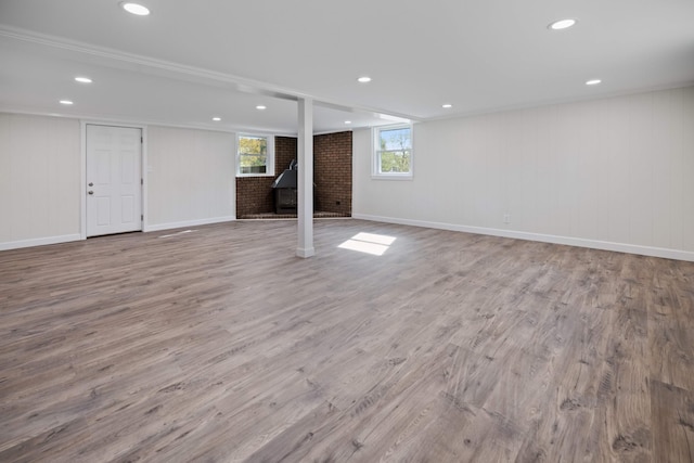 basement with light hardwood / wood-style floors