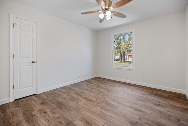 unfurnished room featuring hardwood / wood-style floors and ceiling fan