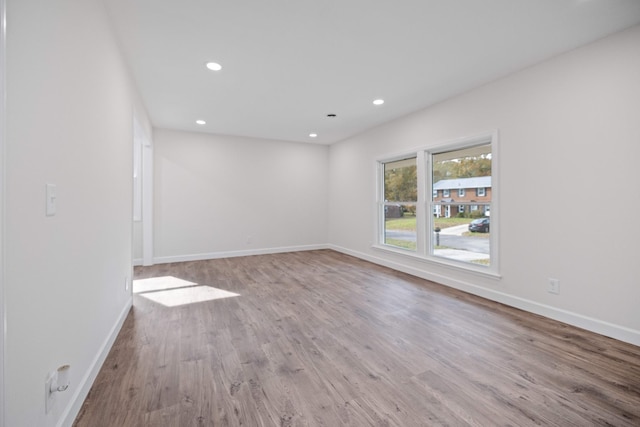 unfurnished room featuring light wood-type flooring