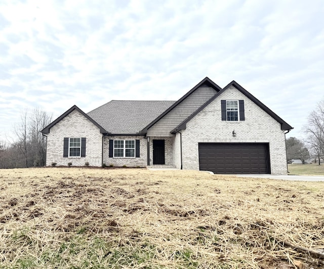 view of front of property with a garage