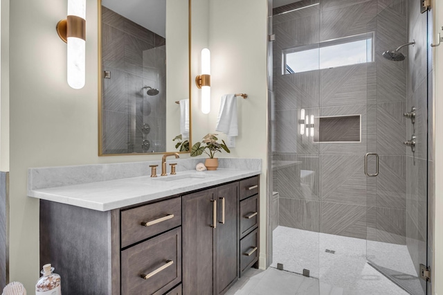 bathroom with an enclosed shower and vanity