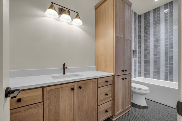 bathroom featuring toilet, vanity, and tile patterned flooring