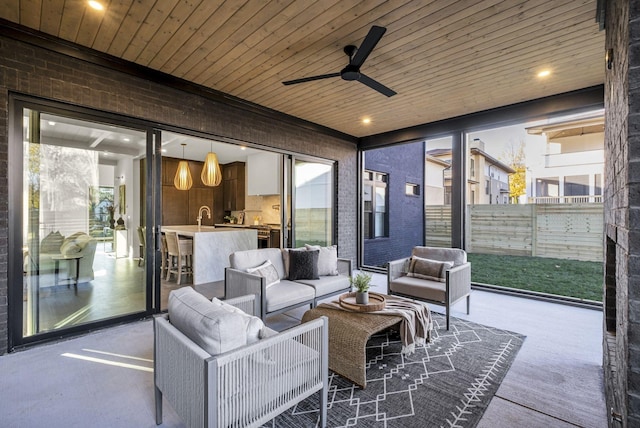 view of patio / terrace featuring an outdoor living space and ceiling fan