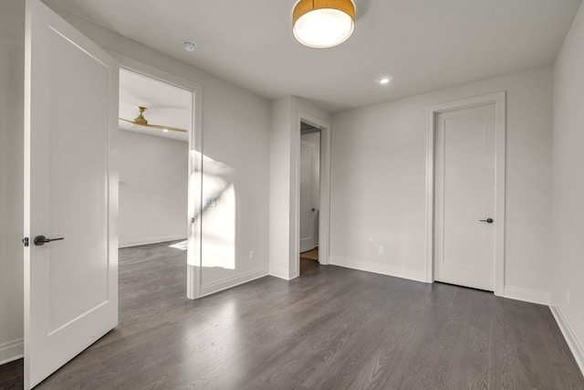 unfurnished bedroom with dark hardwood / wood-style flooring