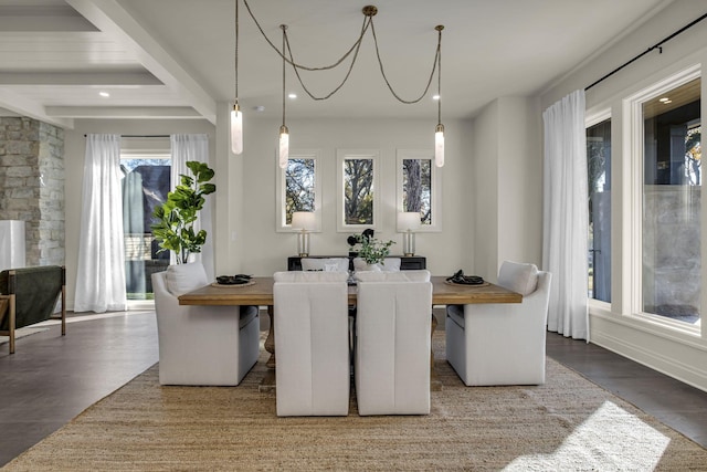 dining area featuring beamed ceiling and hardwood / wood-style floors