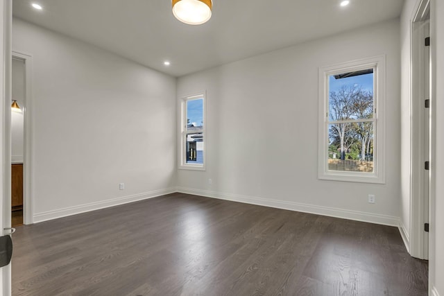 empty room featuring dark wood-type flooring