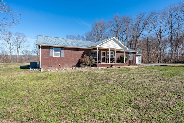 ranch-style house with metal roof, covered porch, brick siding, crawl space, and a front lawn