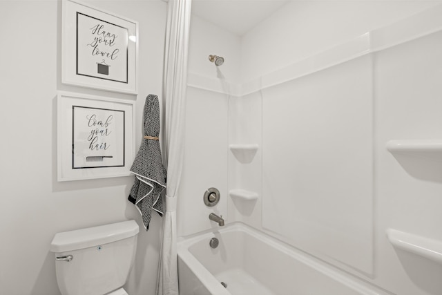 bathroom with shower / bath combination and toilet