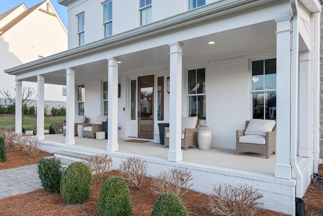 view of exterior entry featuring a porch