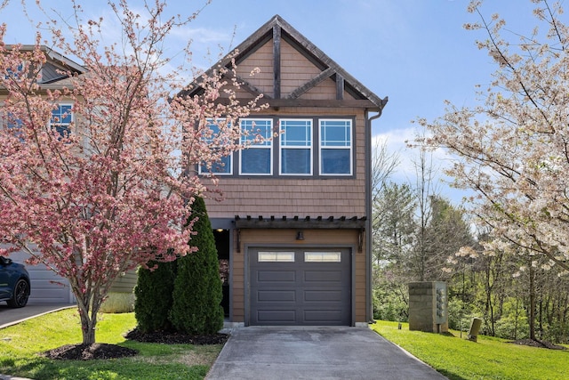 view of front of house with a front lawn and a garage