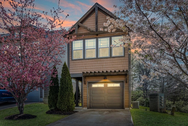 front facade with central AC and a garage