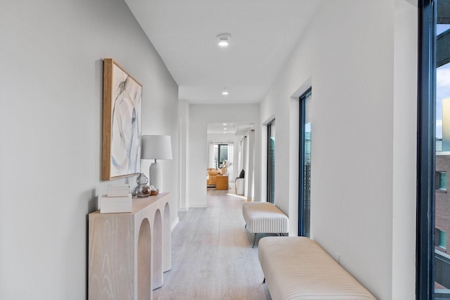 corridor with light wood-type flooring