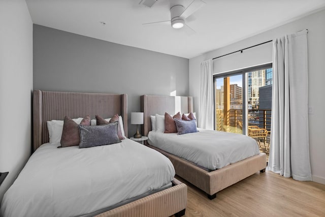 bedroom with ceiling fan, light hardwood / wood-style floors, and access to outside