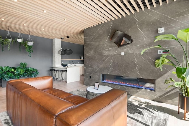 635 7th Ave S Unit 501, Nashville, TN 37203 - living area featuring wood finished floors and a glass covered fireplace