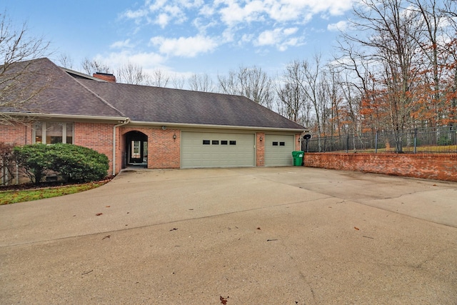 single story home with a garage