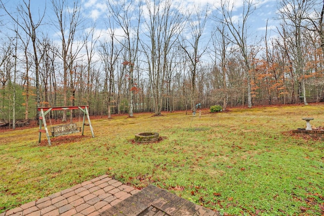 view of yard featuring a fire pit