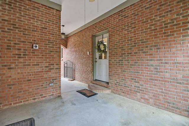 entrance to property featuring ceiling fan