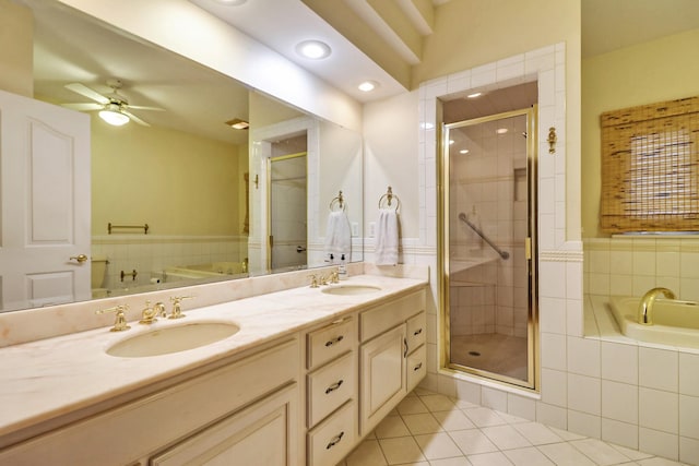 bathroom with ceiling fan, vanity, independent shower and bath, and tile patterned floors