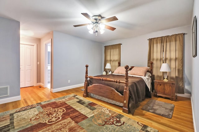 bedroom with ceiling fan and light hardwood / wood-style floors