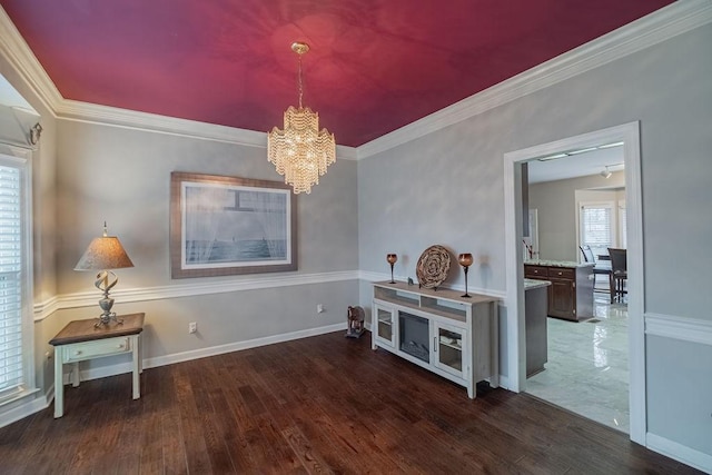 306 Amherst Dr, Tullahoma, TN 37388 - dining room featuring a chandelier, wood finished floors, crown molding, and baseboards