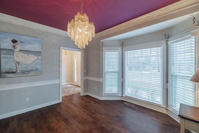 306 Amherst Dr, Tullahoma, TN 37388 - unfurnished dining area with a chandelier, plenty of natural light, wood finished floors, and baseboards